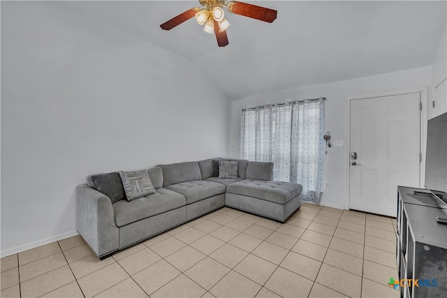 living room with light tile patterned flooring, lofted ceiling, and ceiling fan