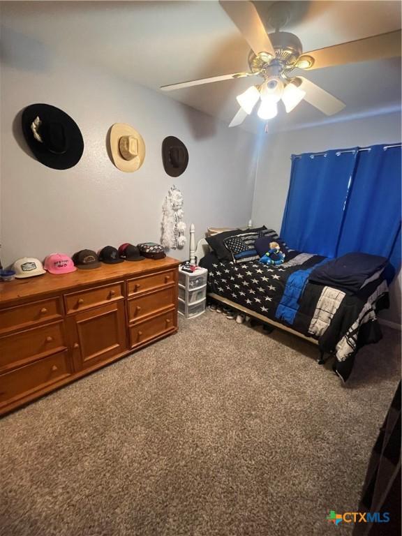 110 Idylwood Pl, Victoria, TX 77901 - carpeted bedroom featuring a ceiling fan