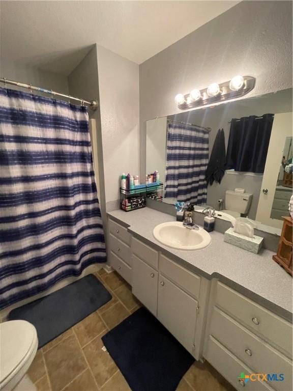 110 Idylwood Pl, Victoria, TX 77901 - bathroom with toilet, tile patterned floors, vanity, and a shower with curtain