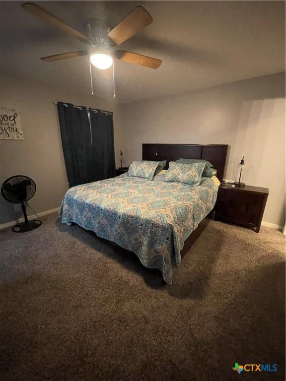 110 Idylwood Pl, Victoria, TX 77901 - bedroom with carpet floors, baseboards, and a ceiling fan