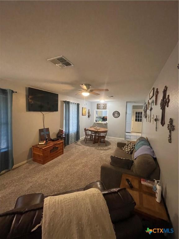 110 Idylwood Pl, Victoria, TX 77901 - living area featuring carpet, a ceiling fan, and baseboards