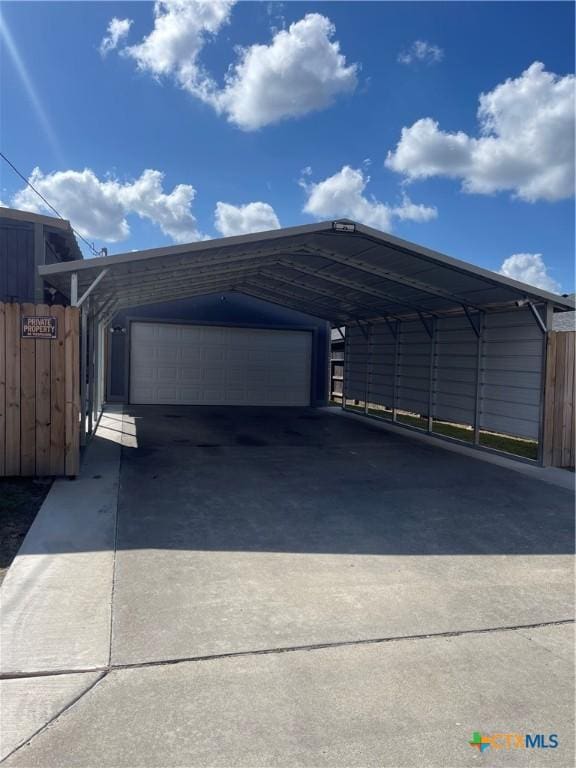 110 Idylwood Pl, Victoria, TX 77901 - view of car parking featuring a garage and driveway