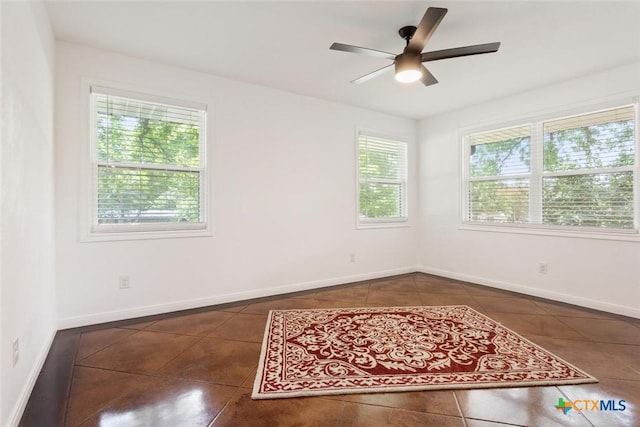 2302 Brooklawn Dr, Temple, TX 76502 - tiled spare room featuring ceiling fan and baseboards