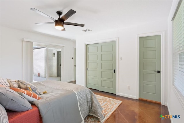 2302 Brooklawn Dr, Temple, TX 76502 - bedroom featuring dark tile patterned flooring, a closet, and a ceiling fan