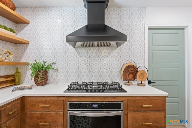 2302 Brooklawn Dr, Temple, TX 76502 - kitchen with wall chimney range hood, stainless steel appliances, open shelves, backsplash, and light countertops