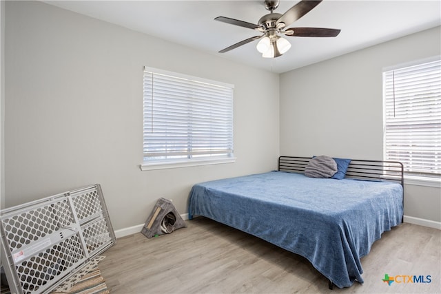 bedroom featuring light hardwood / wood-style flooring and ceiling fan