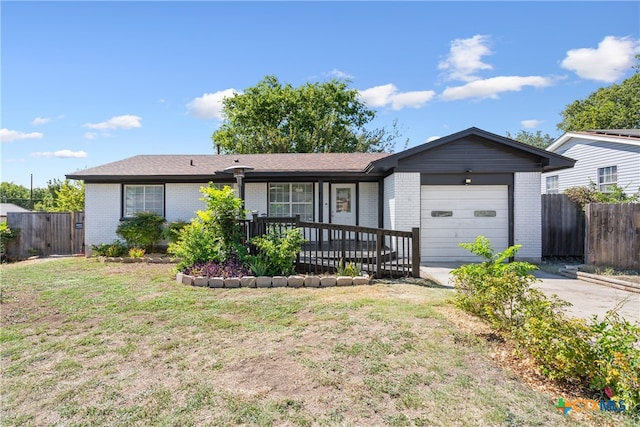 single story home with a garage and a front yard