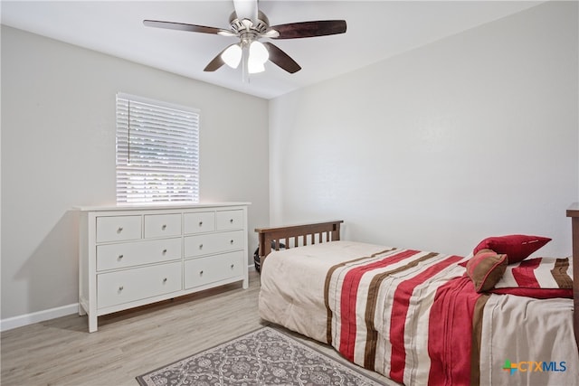 bedroom featuring light hardwood / wood-style flooring and ceiling fan