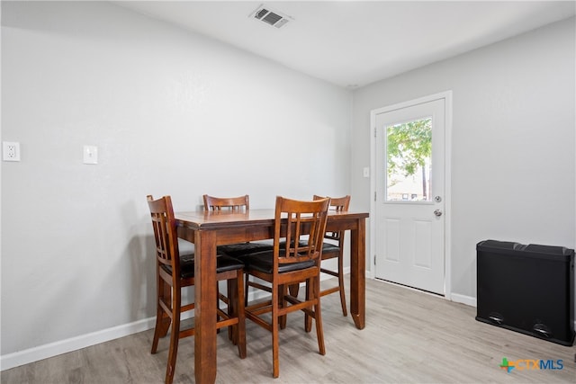 dining space featuring light wood-type flooring