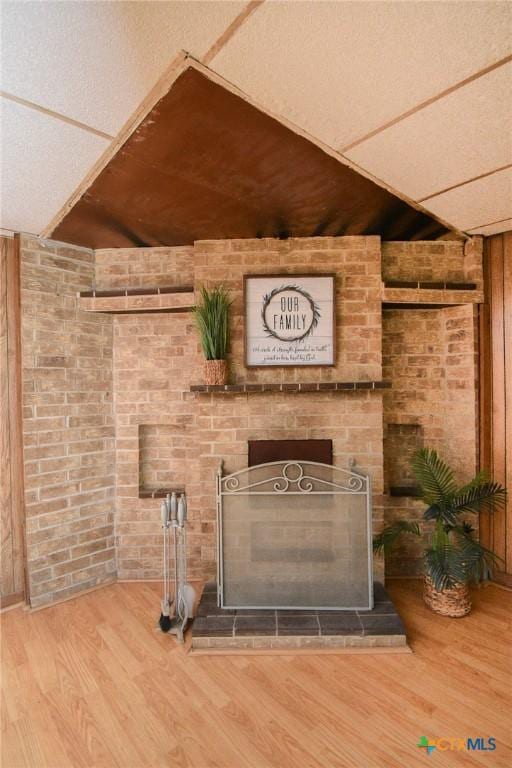 127 S Mesquite Dr, Victoria, TX 77905 - detailed view of wood finished floors and a fireplace