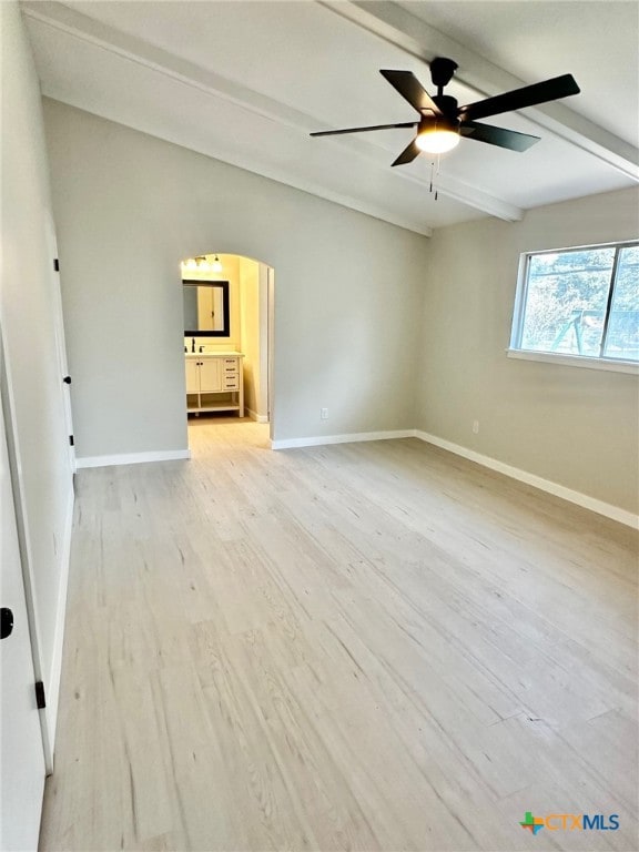 interior space with beam ceiling, light wood-type flooring, and ceiling fan