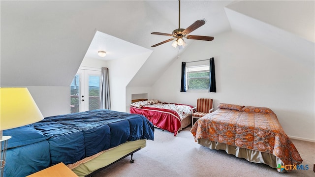 bedroom with access to exterior, multiple windows, ceiling fan, and vaulted ceiling