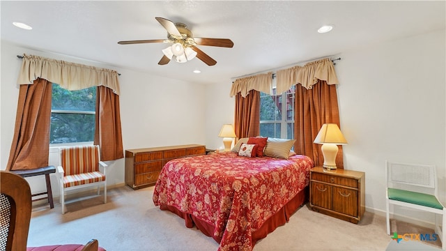 carpeted bedroom featuring ceiling fan