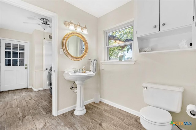 bathroom with ceiling fan, hardwood / wood-style flooring, and toilet