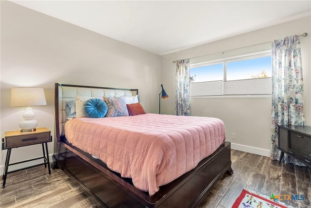 bedroom featuring dark hardwood / wood-style flooring