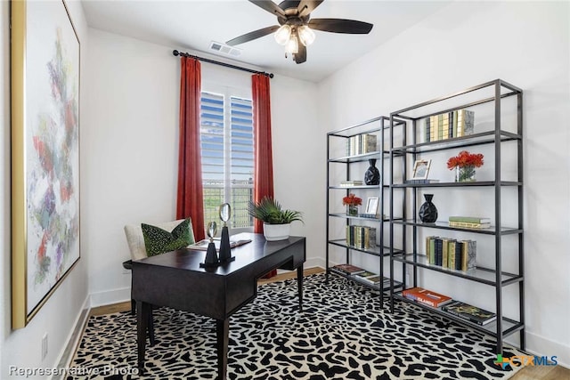 office area with hardwood / wood-style flooring and ceiling fan