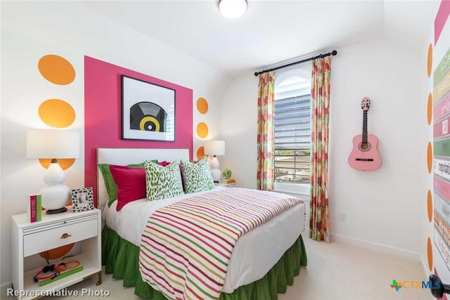 carpeted bedroom featuring vaulted ceiling