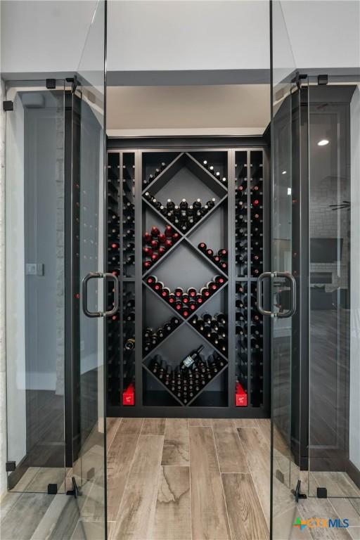 wine room with wood finished floors