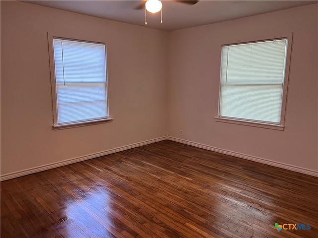 unfurnished room featuring dark hardwood / wood-style flooring and ceiling fan