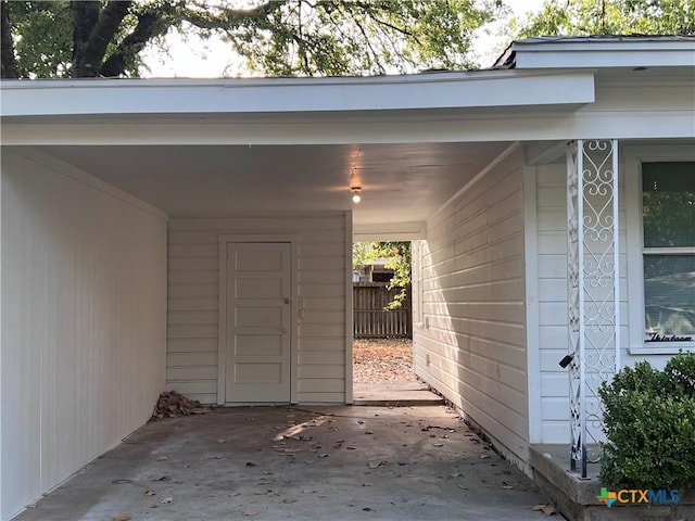 entrance to property featuring an attached carport