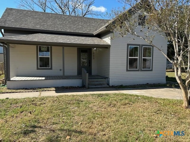 view of front of home featuring covered porch and a front lawn