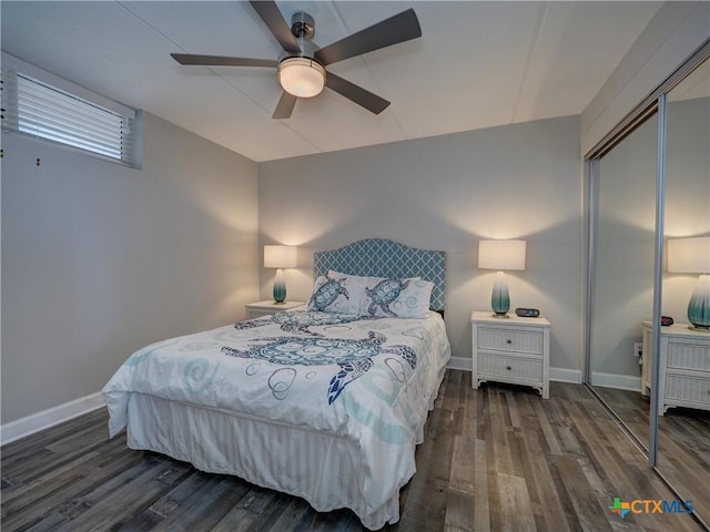 6021 State Highway 361 Unit 108, Port Aransas, TX 78373 - bedroom featuring wood finished floors, a closet, baseboards, and a ceiling fan