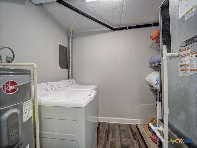 6021 State Highway 361 Unit 108, Port Aransas, TX 78373 - clothes washing area featuring independent washer and dryer, wood finished floors, electric water heater, heating unit, and baseboards