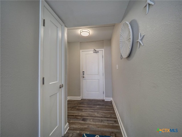 6021 State Highway 361 Unit 108, Port Aransas, TX 78373 - corridor featuring wood finished floors, baseboards, and a textured wall