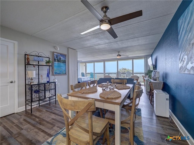 6021 State Highway 361 Unit 108, Port Aransas, TX 78373 - dining area featuring ceiling fan, wood finished floors, and a textured ceiling