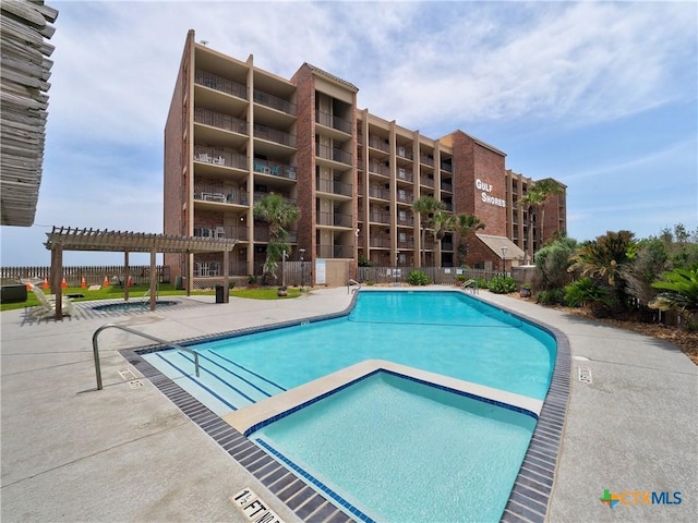 6021 State Highway 361 Unit 108, Port Aransas, TX 78373 - community pool with a pergola and fence