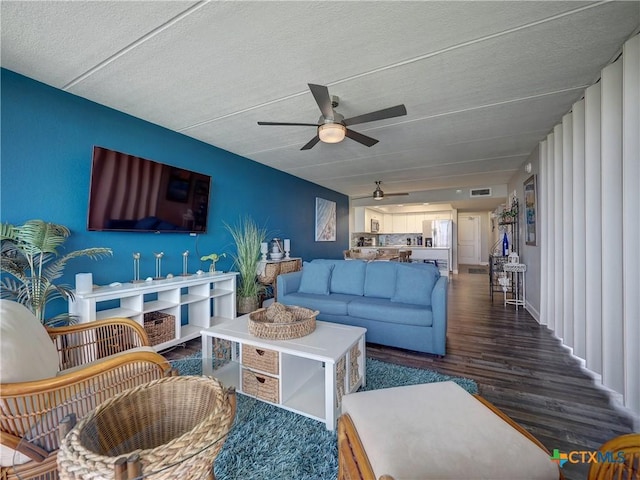 6021 State Highway 361 Unit 108, Port Aransas, TX 78373 - living room with ceiling fan, wood finished floors, and a textured ceiling