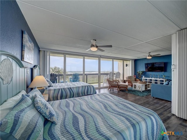 6021 State Highway 361 Unit 108, Port Aransas, TX 78373 - bedroom featuring access to outside, wood finished floors, ceiling fan, and a wall of windows