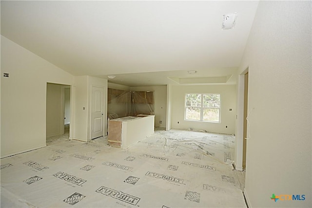 unfurnished living room with lofted ceiling