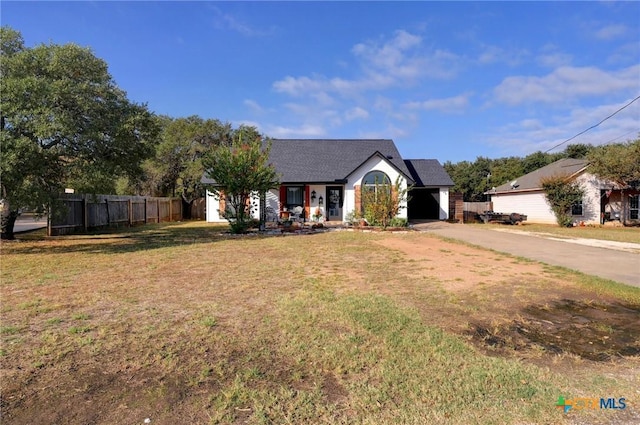 view of front of home featuring a garage and a front yard