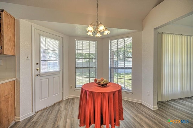 204 James Loop, Killeen, TX 76542 - dining space featuring wood finished floors, a chandelier, plenty of natural light, and baseboards