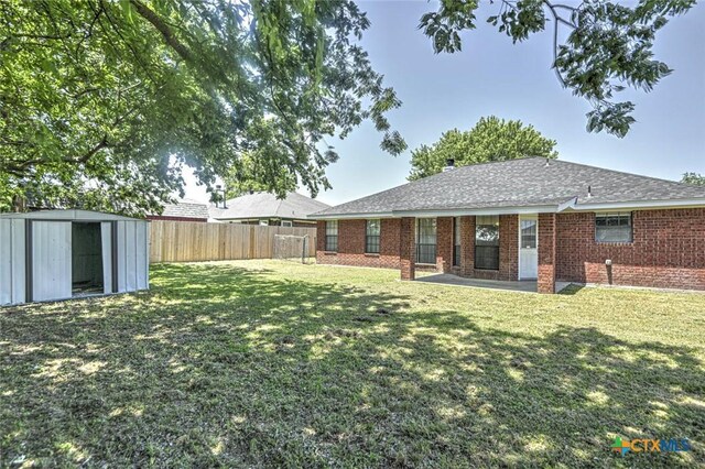 204 James Loop, Killeen, TX 76542 - rear view of house featuring a shed and brick siding