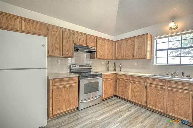 204 James Loop, Killeen, TX 76542 - kitchen featuring freestanding refrigerator, electric range, under cabinet range hood, and tasteful backsplash
