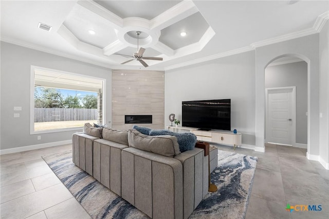 living room featuring ornamental molding, coffered ceiling, and ceiling fan