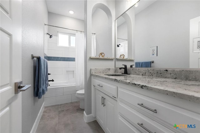 full bathroom with shower / tub combo, vanity, tile patterned flooring, and toilet