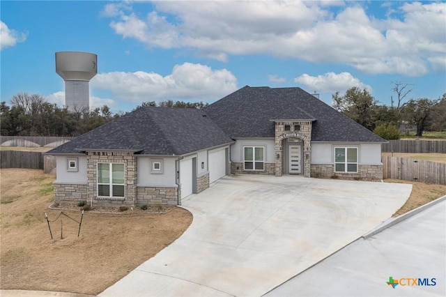 french provincial home featuring a garage