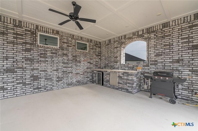 view of patio / terrace featuring sink and ceiling fan