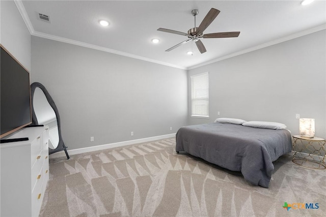 carpeted bedroom featuring ceiling fan and ornamental molding