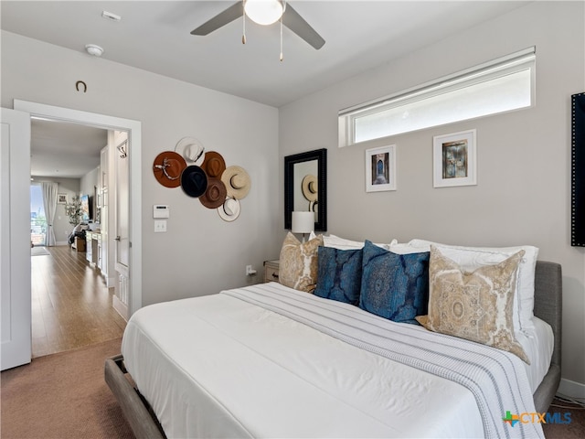 bedroom with hardwood / wood-style flooring and ceiling fan