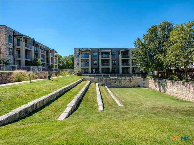 surrounding community featuring a lawn