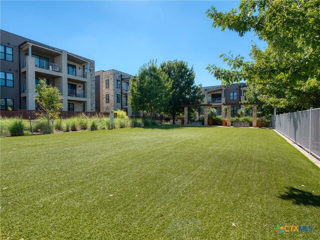 view of yard featuring a balcony