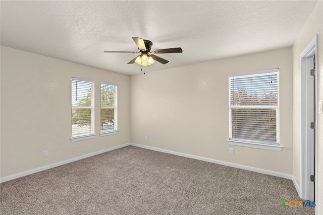 213 Springtree Pkwy, Cibolo, TX 78108 - empty room featuring ceiling fan, carpet flooring, and a textured ceiling