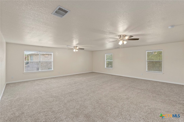 213 Springtree Pkwy, Cibolo, TX 78108 - carpeted spare room with a ceiling fan, a textured ceiling, and a smoke detector