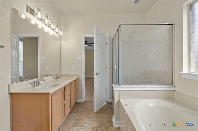 213 Springtree Pkwy, Cibolo, TX 78108 - full bathroom featuring a jetted tub, double vanity, a ceiling fan, and a stall shower