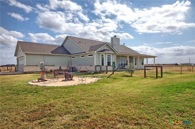 rear view of property with a lawn