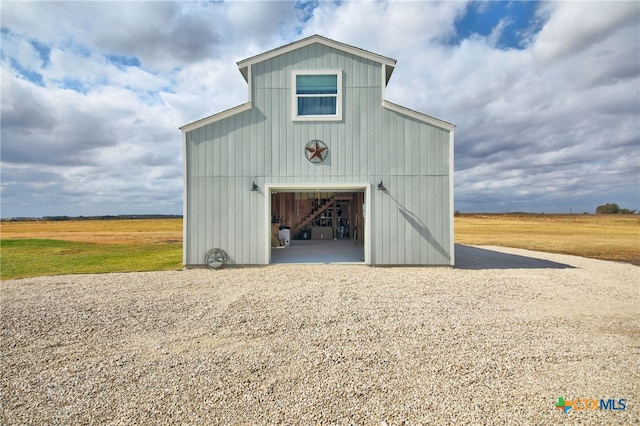 view of outbuilding featuring a rural view